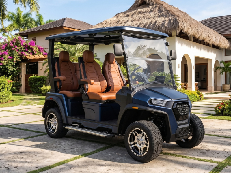 ECO Azure 4 2WD electric golf cart in dark blue with brown seats parked in front of a villa with a thatched roof