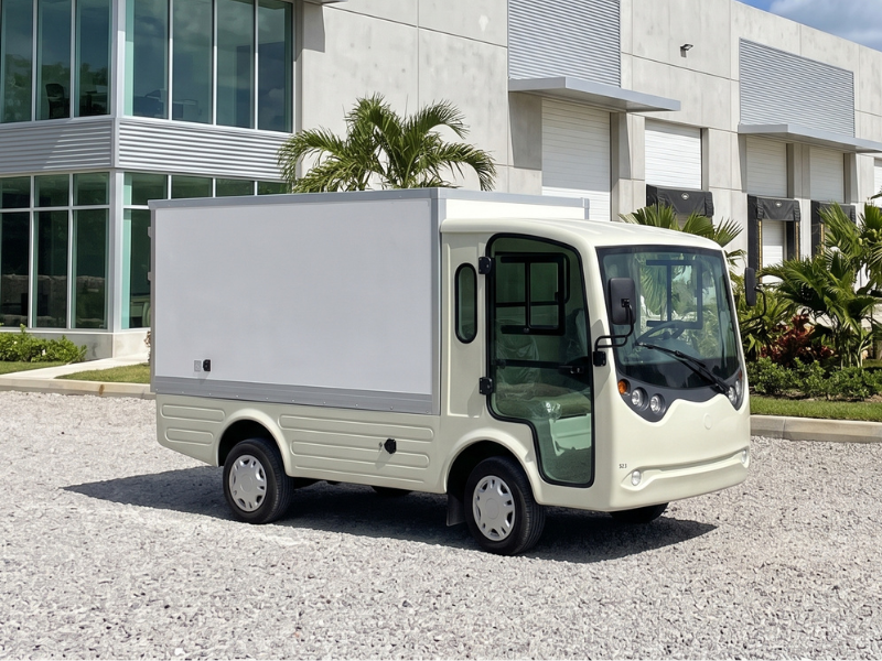 ECO E-Cargo Box electric cargo van with enclosed box body outside a warehouse